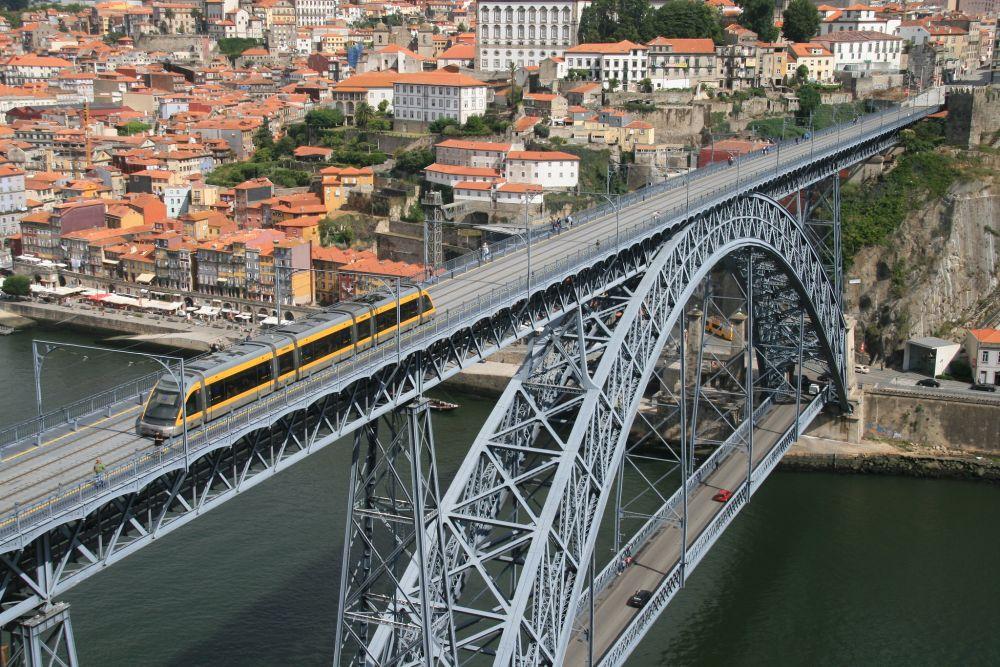 tram going over the Dom Luis Bridge considered one of the Best Things To Do in Porto