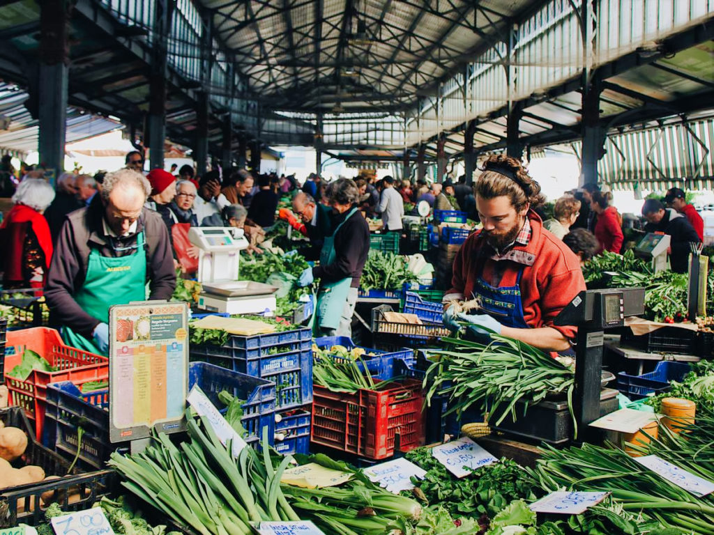 locals lower the cost of living in Turin Italy by shopping at a farmers market