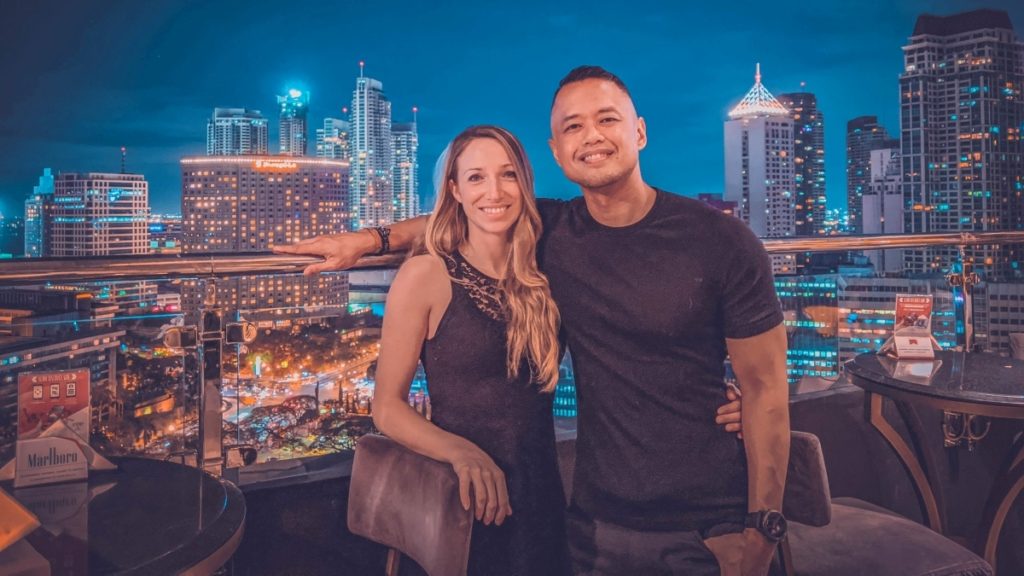 young couple living in the Philippines enjoying the view of Makati