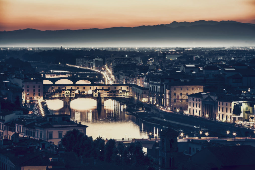view of the city at night make the cost of living in florence italy for an expat worth it