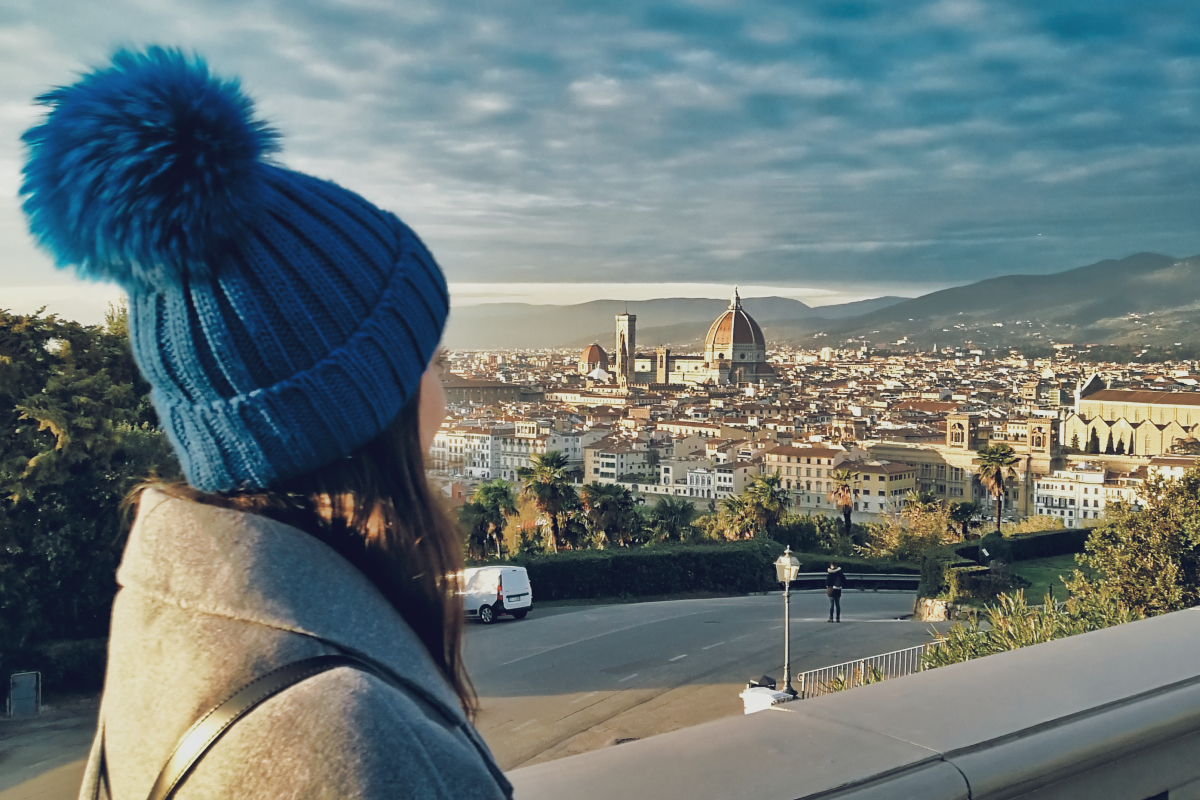 young woman with a city view shares her monthly living costs in Florence Italy